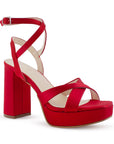 vista diagonal de zapatillas para dama rojas con tacón alto 11 cm y tiras cruzadas al frente