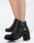 Botines negros con nudo decorativo cierre interno funcional y tacón medio 7cm para dama