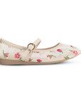 Vista lateral de los flats tipo balerina nude con flores bordadas para dama y suela de piso