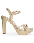 Vista lateral de zapatilla oro para mujer con tiras cruzadas y tacón alto de 11cm
