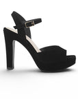 Vista lateral de zapatilla negra para dama con plataforma, pulsera ajustable al tobillo, punta abierta y tacón alto 12cm