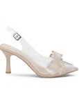 Vista lateral de zapatillas nude transparentes para mujer de diseño destalonado con correa ajustable punta fina moño de pedrería y tacón de 9cm