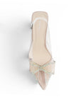 Vista superior de zapatilla nude transparente para mujer con punta fina cerrada y moño de pedrería