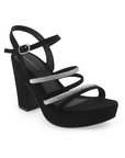 Vista diagonal de zapatilla negra para mujer con tiras y tacón ancho medio de 10cm