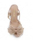 vista superior de zapatillas nude con ajuste al tobillo moño y tacón alto 11cm para dama
