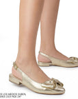 Flats dorados para mujer con moño en punta fina destalonado con correa ajustable