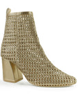 vista diagonal de botas oro con tacón medio 8cm para dama tejidas
