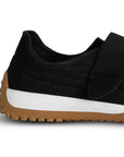 Vista trasera de la suela baja 4cm antiderrapante del tenis negro casual para dama