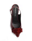 vista superior de zapatillas vino con moño y talón descubierto para dama
