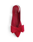 vista superior de flats rojos con moño para mujer