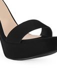 Vista de material buck eleante y formal de zapatilla color negro para mujer