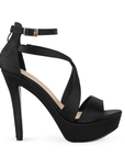 vista lateral de zapatilla negra con hebilla elegante para mujer