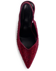 Vista superior en la zapatilla roja con punta fina de pedrería brillante tipo stiletto para dama 
