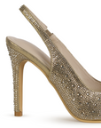 Vista trasera del tacón medio 10 cm delgado con pedrería brillante de la zapatilla dorada tipo stiletto para dama 