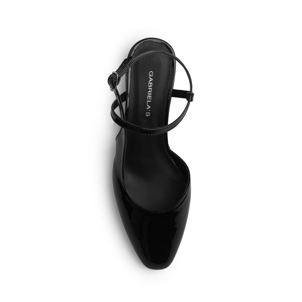 Vista superior de zapatilla negra destalonada para mujer con punta cerrada y pulsera ajustable 
