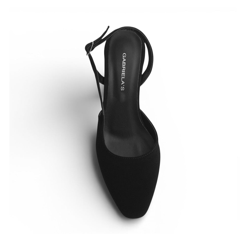 vista superior de zapatilla negra destalonada para mujer con punta cerrada y correa ajustable 