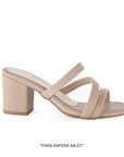 Vista lateral de zapatilla nude para mujer con diseño descubierto tiras cruzadas y tacón medio de 7cm