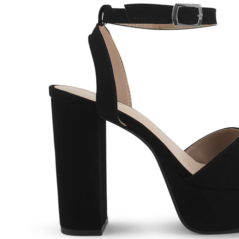 Vista trasera del tacón alto 12cm de la zapatilla negra con plataforma, pulsera ajustable y tiras cruzadas para dama 
