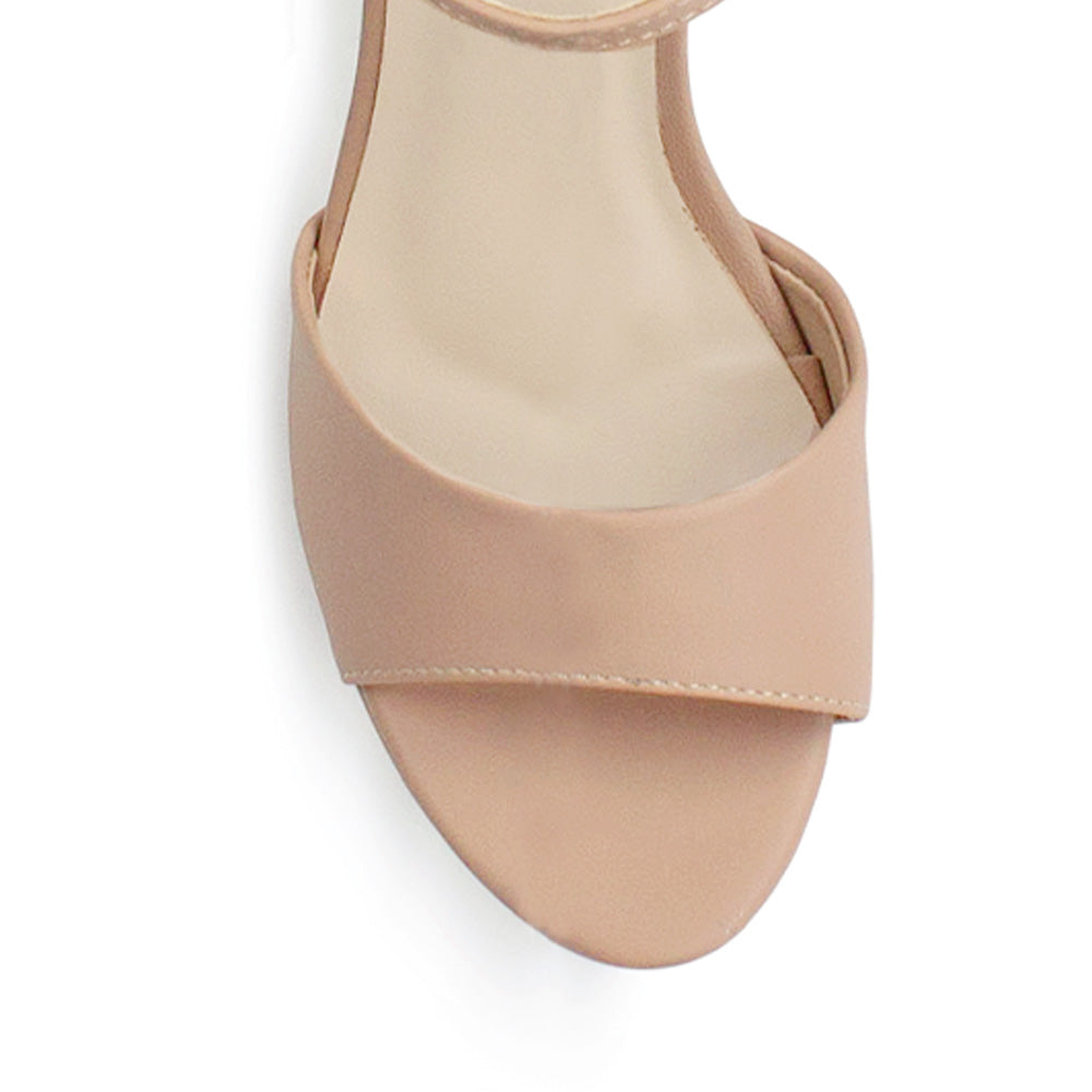 Vista de material cabra sintético en zapatilla nude para mujer con pulsera ajustable y tacón alto ancho de 12cm