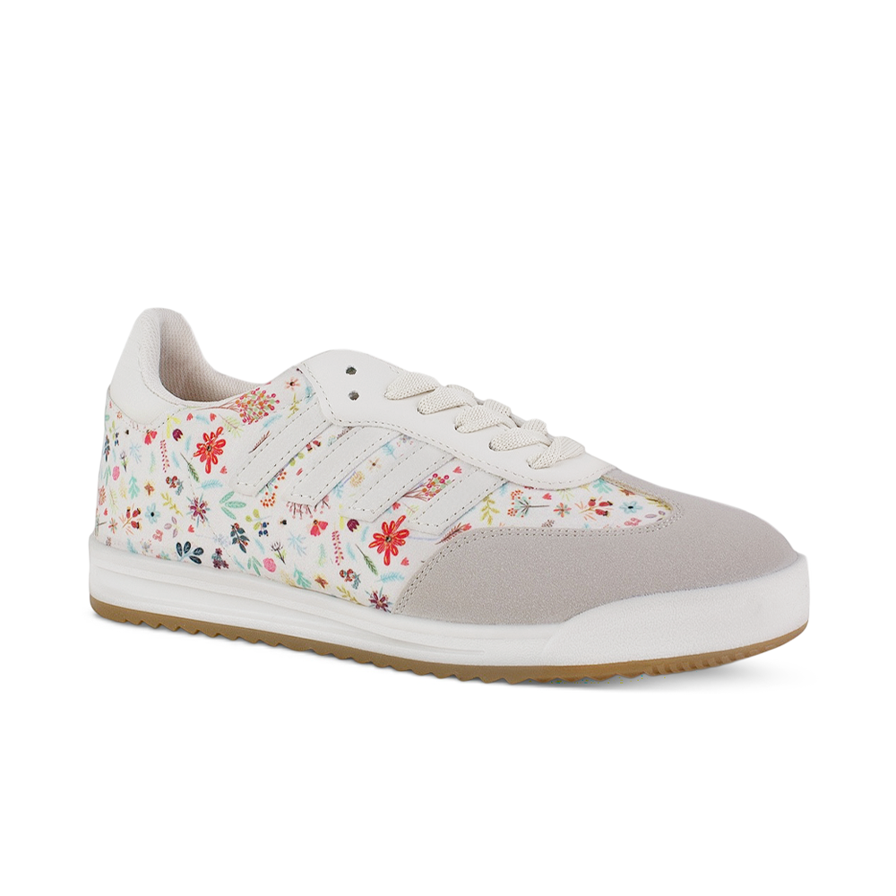 Vista diagonal del tenis beige con punta gris para dama de diseño floral y suela baja 2 cm