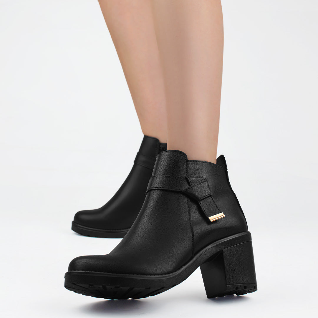 Botines negros con nudo decorativo cierre interno funcional y tacón medio 7cm para dama 