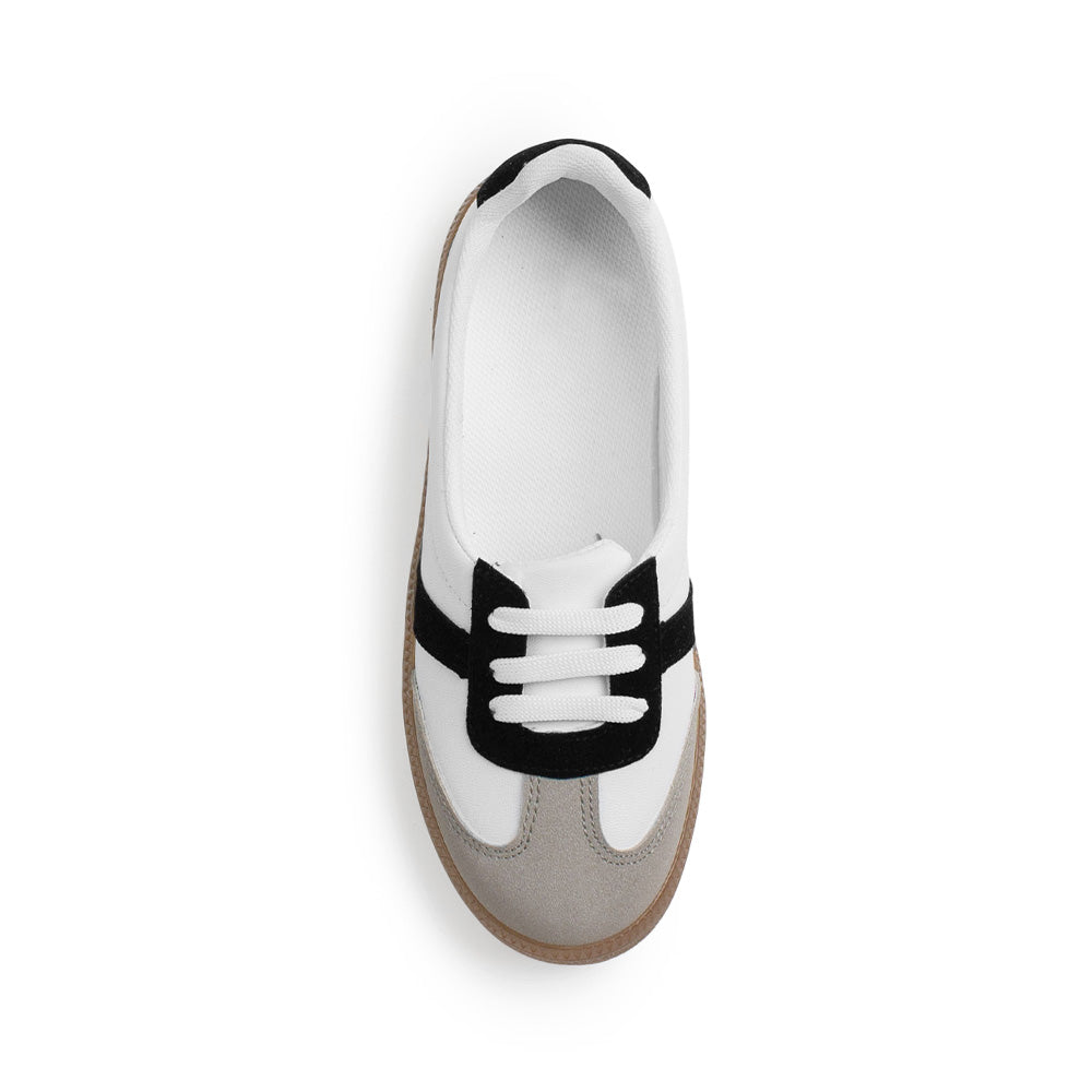 Vista superior de tenis blanco con negro para dama casual con suela baja 2cm 