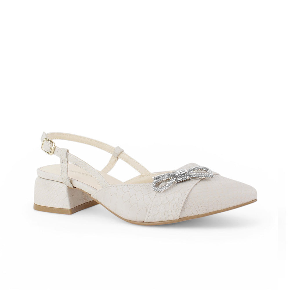 Vista diagonal de zapatilla beige destalonada para mujer con tacón bajo ancho de 4cm moño de pedrería y punta cerrada fina