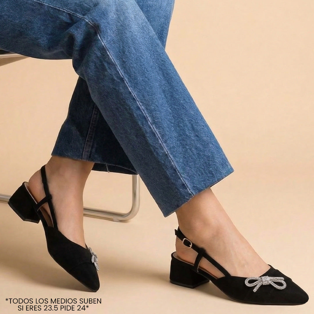 Zapatillas negras destalonada para mujer con punta fina moño de pedrería y tacón bajo de 4cm