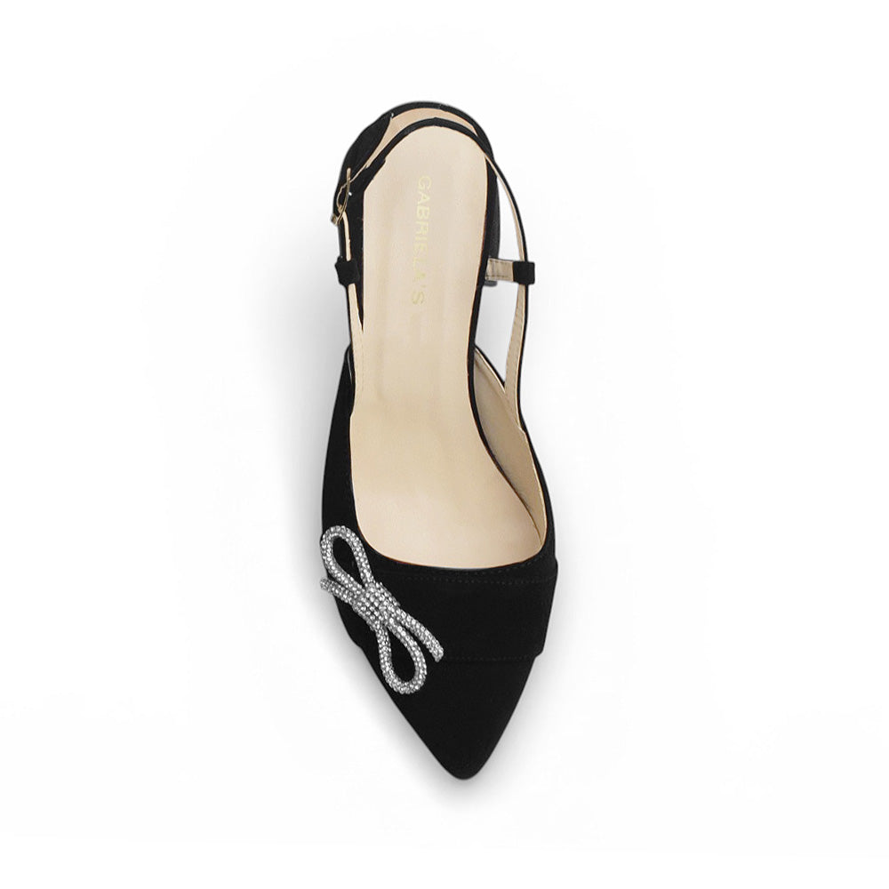 Vista superior de zapatilla destalonada para mujer con moño brilloso punta cerrada y tacón bajo de 4cm en color negro 