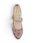 Vista superior de flats tipo balerinas nude transparentes con bordado floral de piso para dama 