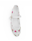 Vista superior de flats tipo balerinas blancas transparentes con bordado floral de piso para dama 