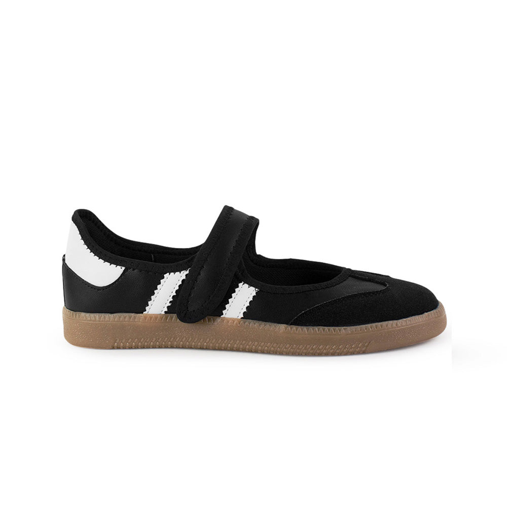 Vista lateral del tenis negro con blanco para dama, pulsera ajustable en el empeine y suela baja 2cm
