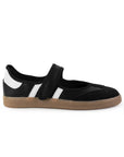 Vista lateral del tenis negro con blanco para dama, pulsera ajustable en el empeine y suela baja 2cm