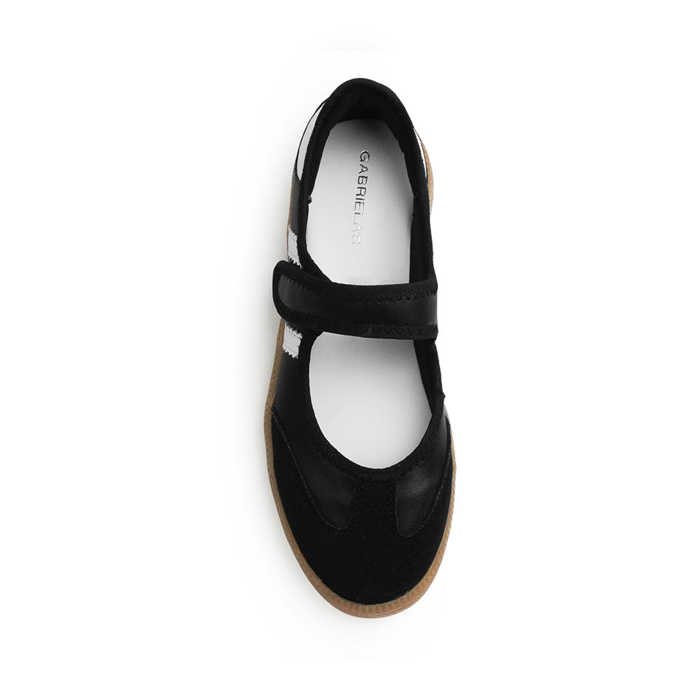 Vista superior del tenis negro con blanco y pulsera ajustable en el empeine para dama de suela baja 2cm 