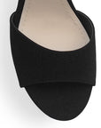 Vista de material buck en zapatilla para mujer con pulsera ajustable y tacón medio de 10cm color negro 