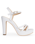 Vista lateral de zapatilla blanca para mujer con tiras cruzadas y tacón alto de 11cm
