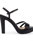 Vista de material cabra sintético en zapatilla negra para mujer con tiras cruzadas y tacón alto de 11cm 