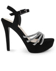 Vista lateral de zapatilla negra para mujer con tiras de pedrería pulsera ajustable y tacón alto delgado de 13cm