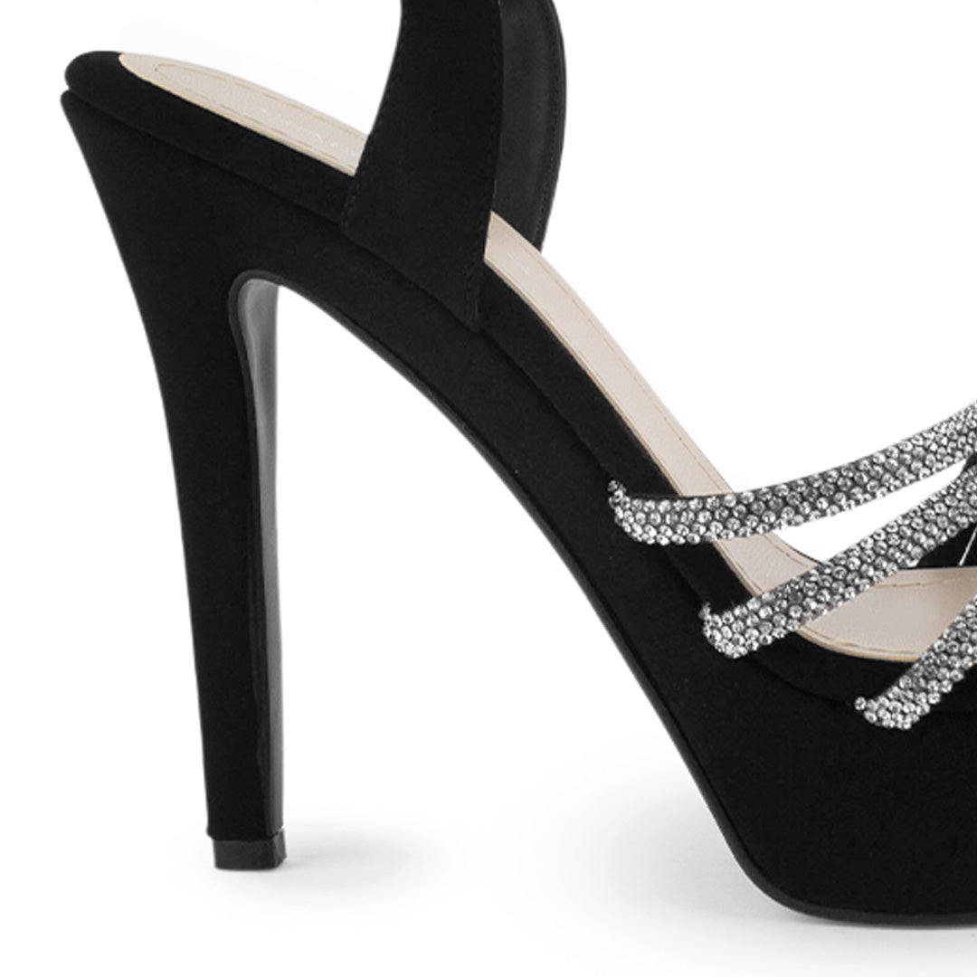 Vista trasera de tacón alto delgado de 13cm en zapatilla negra de diseño descubierto para mujer con pedrería y pulsera ajustable al tobillo
