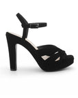Vista lateral de zapatilla negra de diseño descubierto para mujer con tacón alto de 12cm y pulsera ajustable 