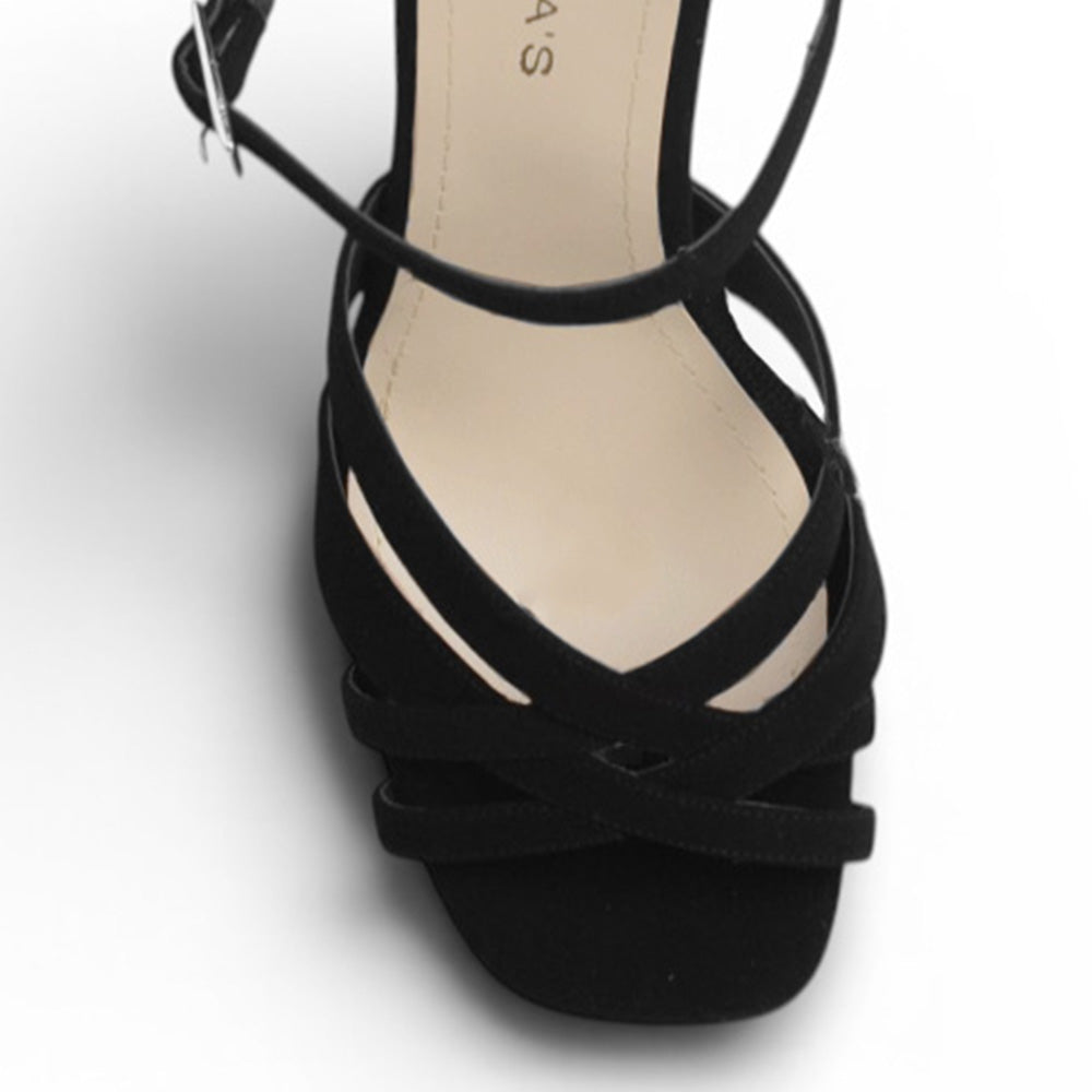 Vista de material buck en zapatilla de diseño descubierto para mujer con tiras cruzadas pulsera ajustable y tacón alto de 12cm en color negro