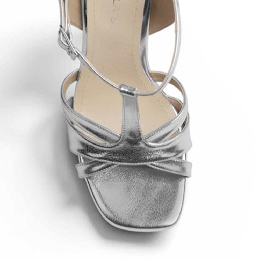 Vista de material sintético en zapatilla para mujer con pulsera y tacón alto de 12cm en color plateado