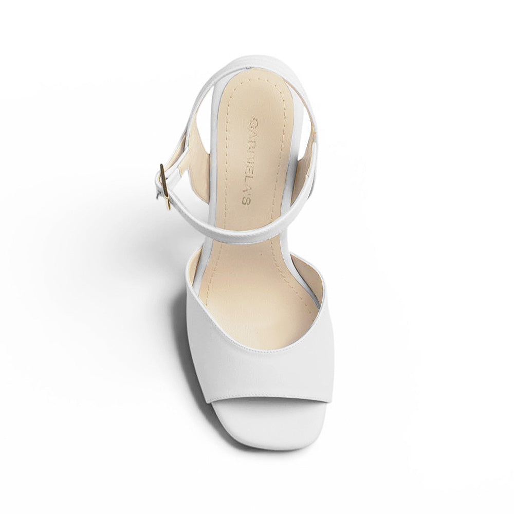 Vista superior de zapatilla para dama blanca con punta abierta pulsera ajustable al tobillo y plataforma tacón alto 12cm 