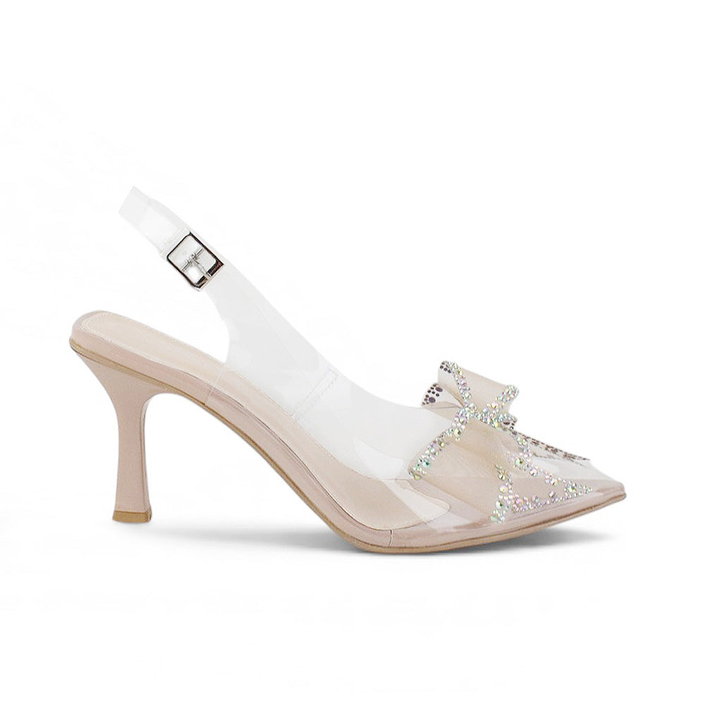 Vista lateral de zapatillas nude transparentes para mujer de diseño destalonado con correa ajustable punta fina moño de pedrería y tacón de 9cm
