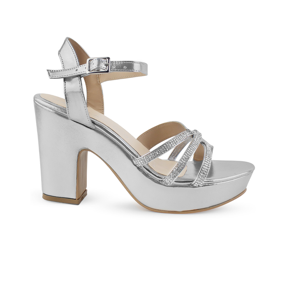 Vista lateral de zapatilla plateada de plataforma para mujer con tiras de pedrería y tacón ancho medio de 10cm