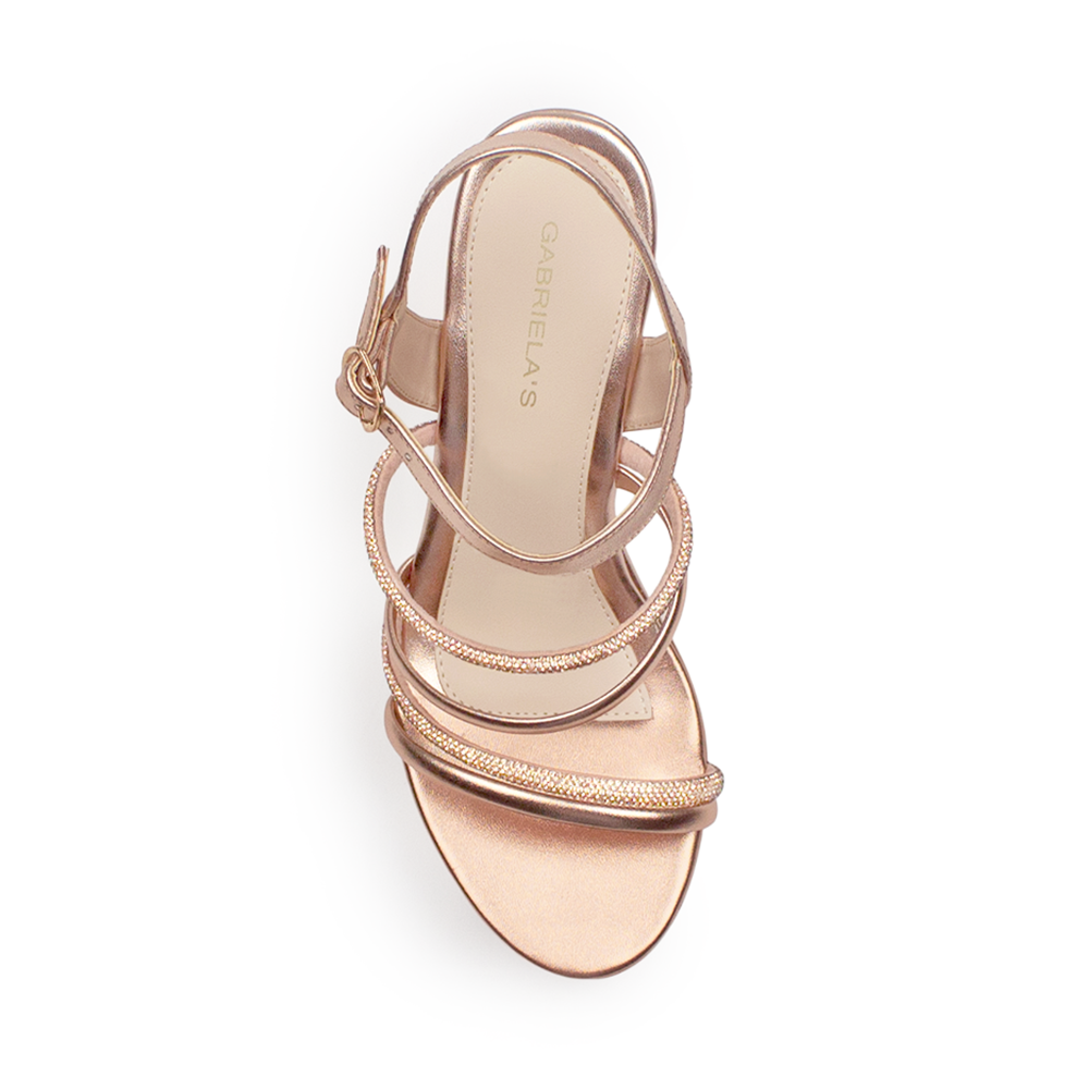 Vista superior de zapatilla oro rosado para mujer con tiras brillantes y pulsera ajustable 