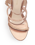 Vista de material sintético en zapatilla oro rosado para mujer con tiras de pedrería brillante