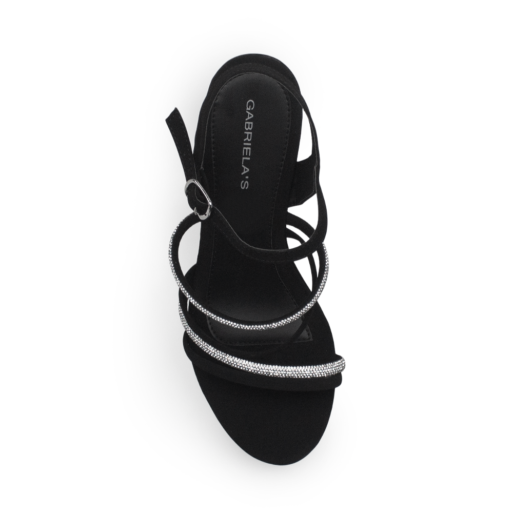 Vista superior de zapatilla negra para mujer con tiras brillantes y pulsera ajustable 