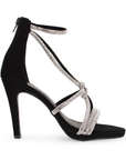 Vista lateral de zapatilla negra para mujer con pedrería brillante y tacón delgado de 10cm