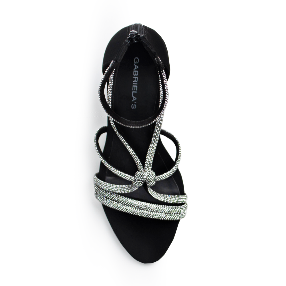 Vista superior de zapatilla negra para mujer con pedrería brillante en tiras cruzadas 